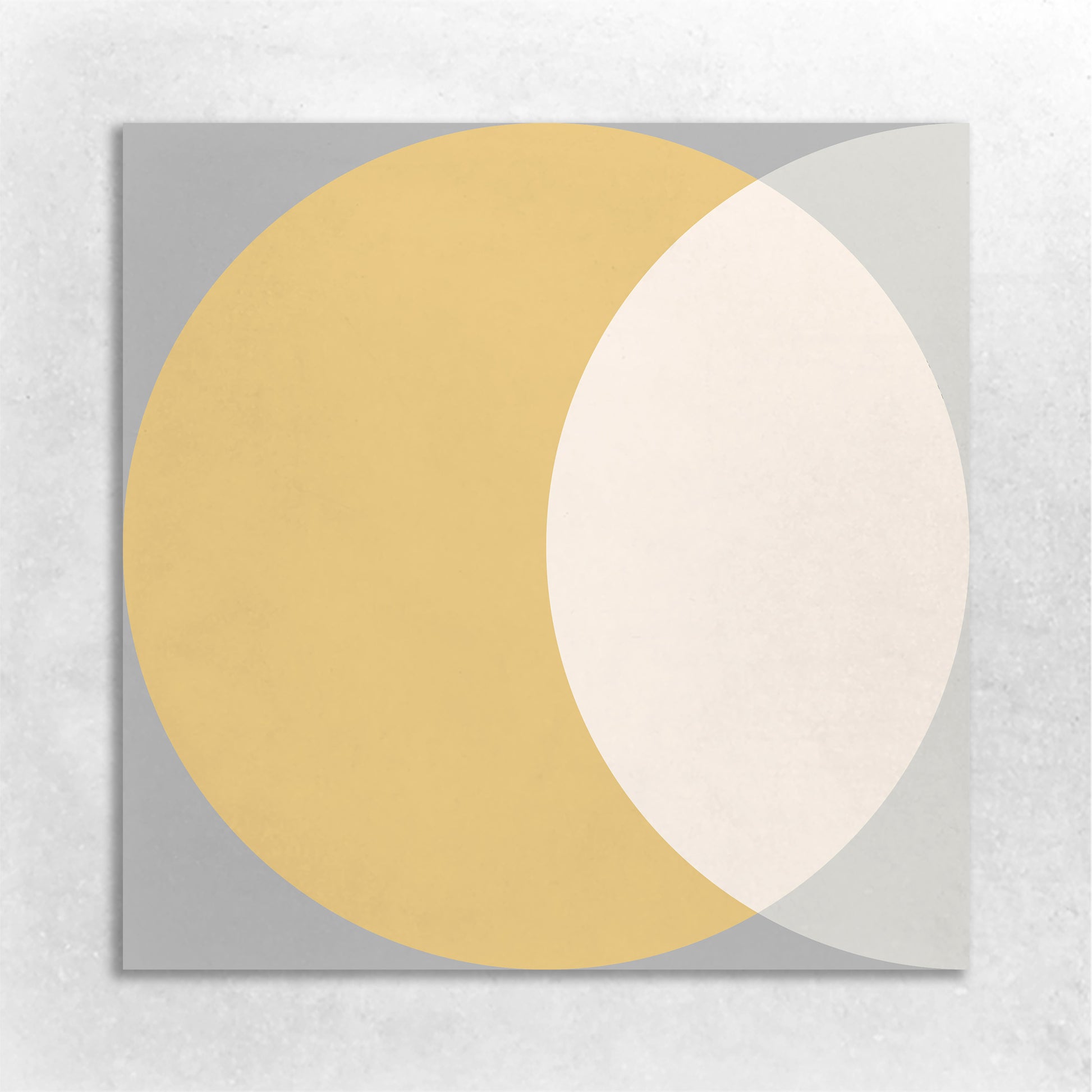 a geometric pattern of overlapping circle in the colors of gold, beige, dark grey, light grey