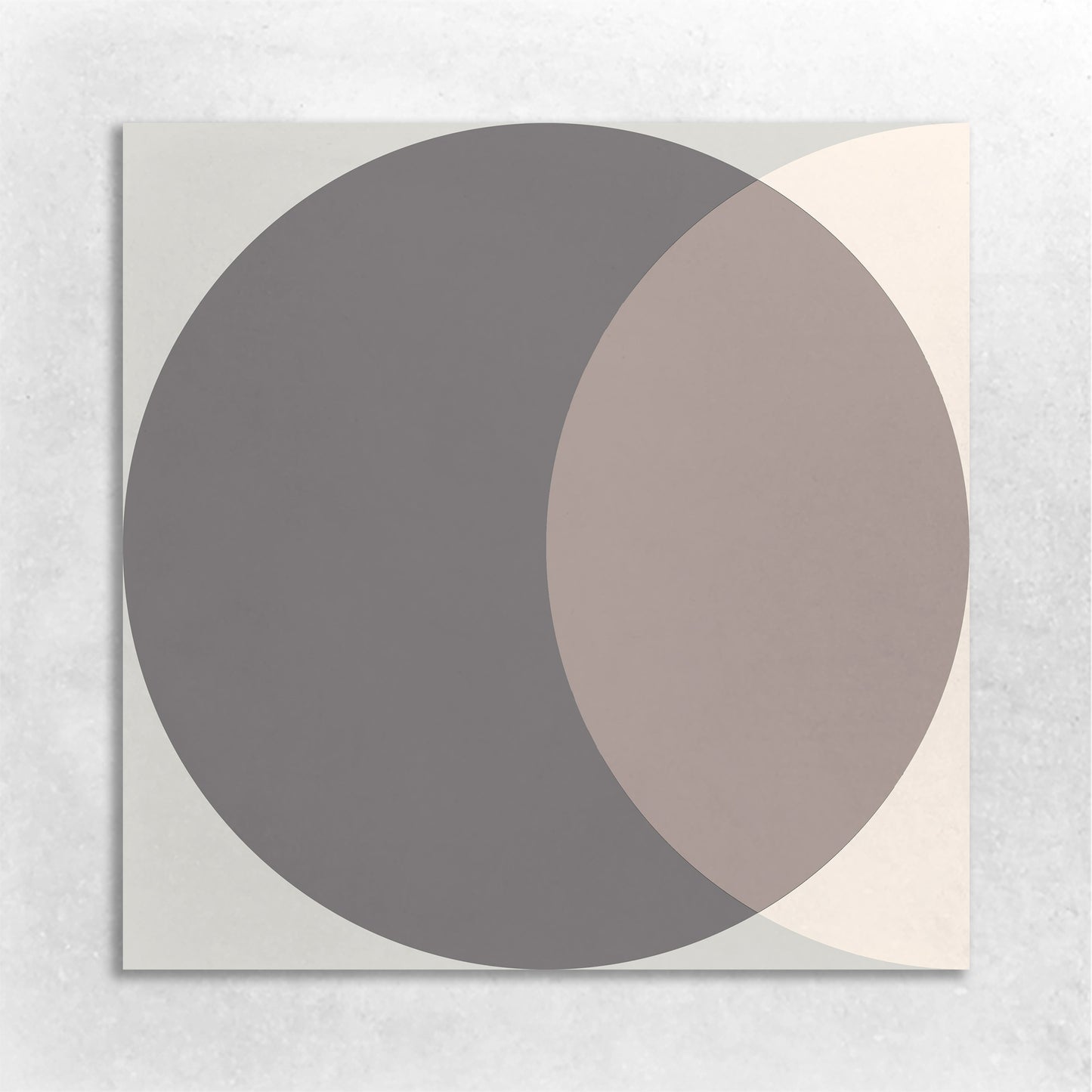 a 8x8 cement tile with a circle graphic in colors of beige, grey, and brown