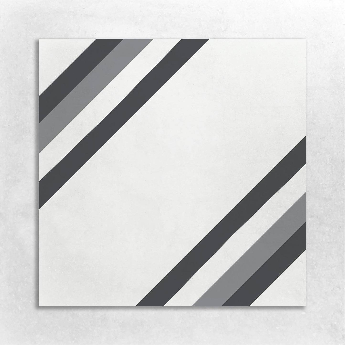 A white square tile bordered in Black, white, and grey stripes