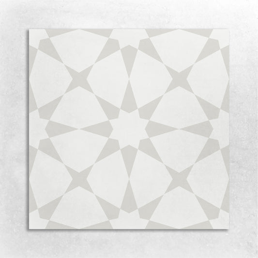 an 8x8 cement tile with a Moroccan  star pattern in antique white and white