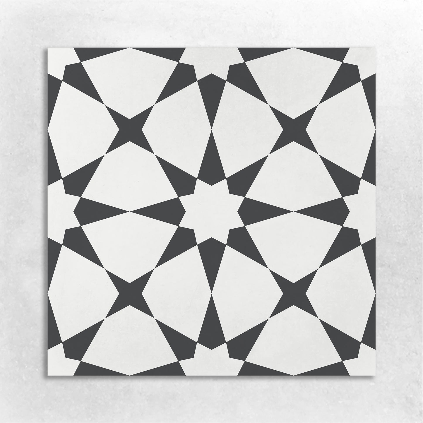 8x8 cement tile with a Moroccan star pattern in white and black colors